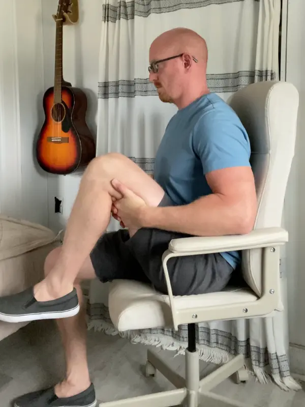 Seated Knee to chest exercise for knee pain