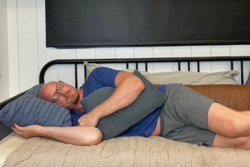 Side sleeping with pillow is one of the best sleeping position for shoulder pain.