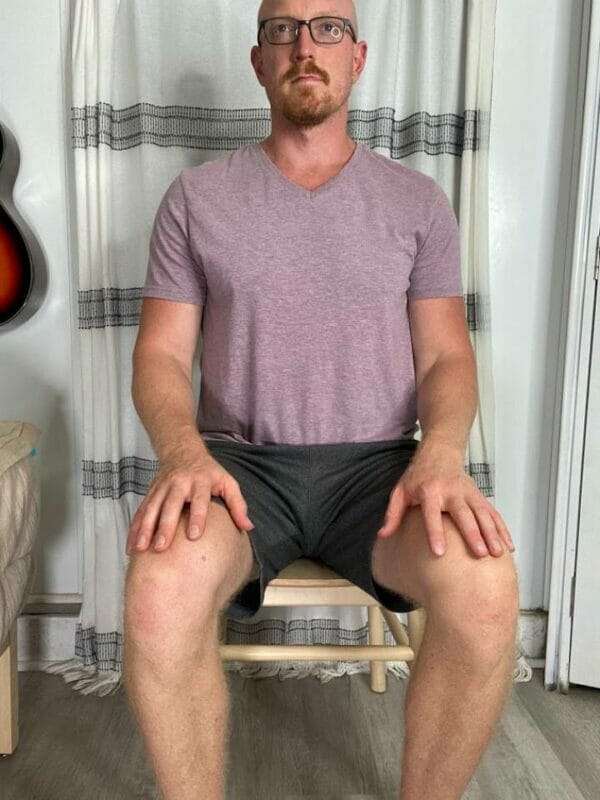 Seated Crossover Stretch step 1