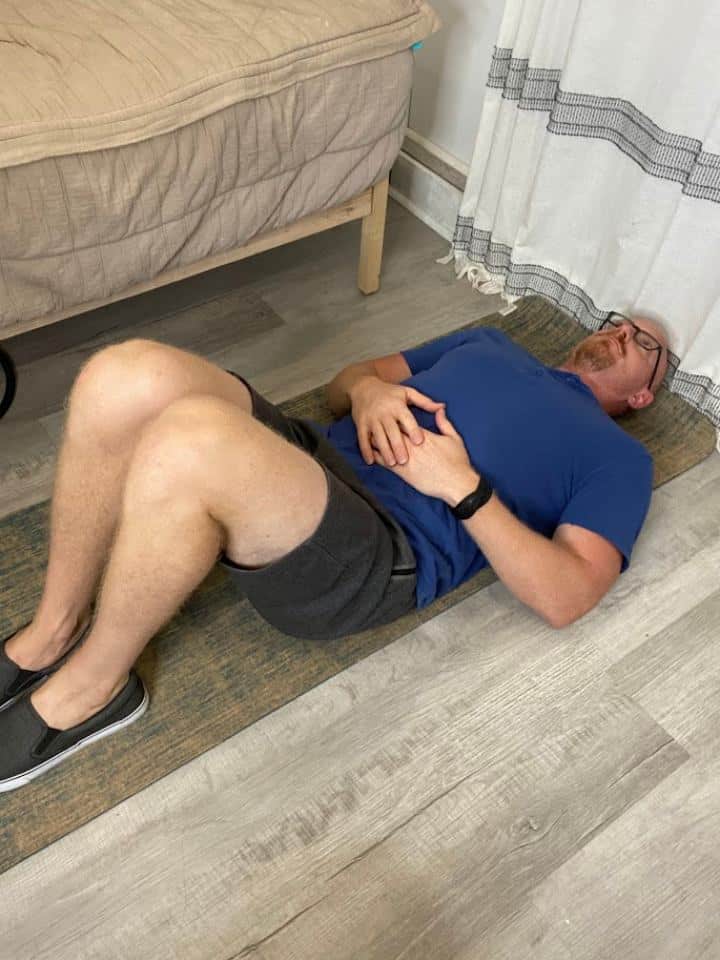 Coach Todd demonstrating the Butterfly Stretch, a beneficial exercise for managing Pes Anserine Bursitis, aimed at enhancing flexibility of the inner thigh muscles and promoting knee health