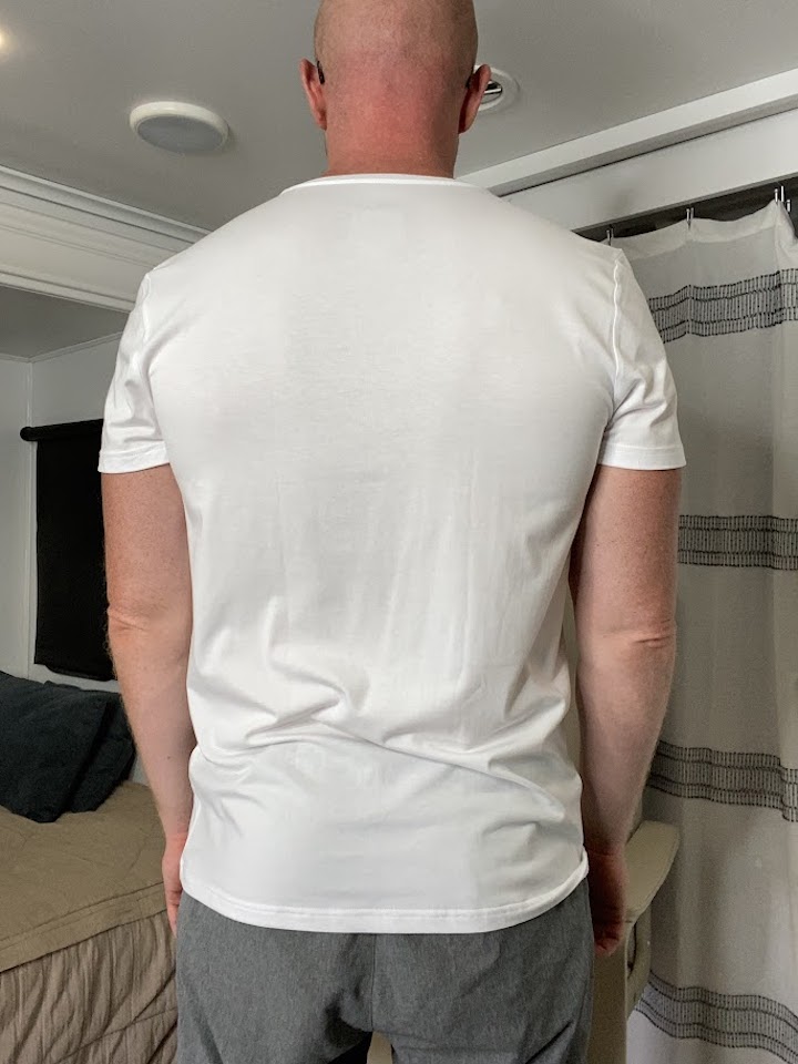 Coach Todd performing scapular retraction step 1, a key exercise for trapezius pain relief, promoting improved upper body posture and shoulder stability