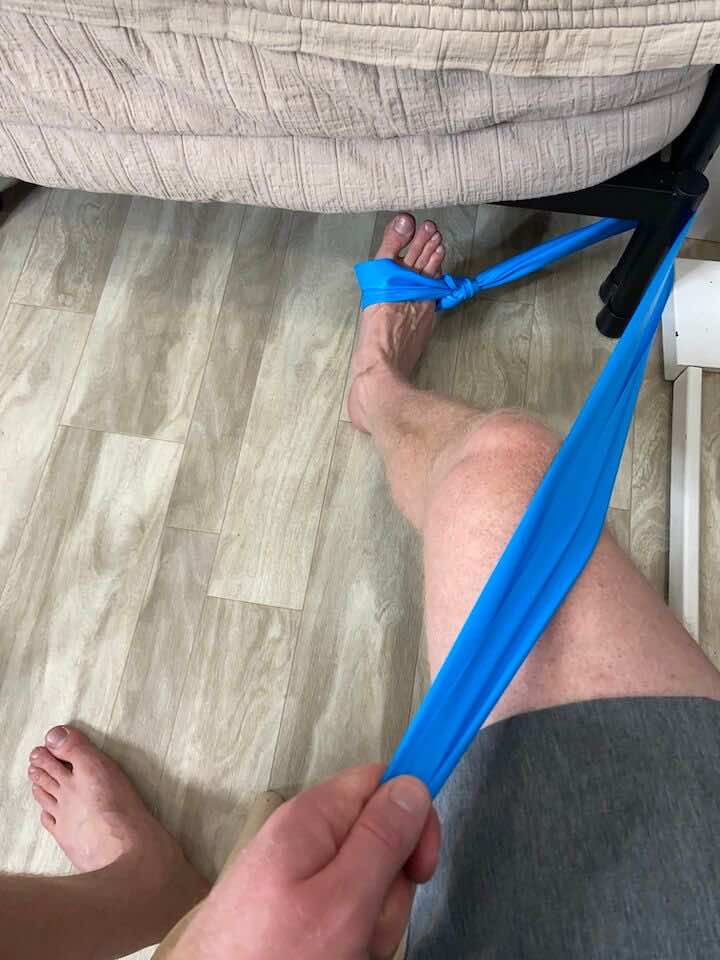 Coach Todd executing Ankle Eversion with a Resistance Band, a key part of the Achilles Bursitis recovery routine, targeted at strengthening the muscles that support the ankle and promote healthy joint function